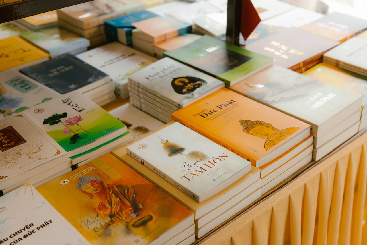 our-services-1 A diverse collection of books neatly arranged on a table indoors.